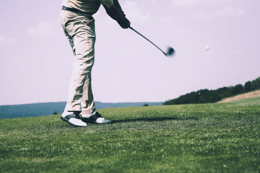 A golf club and golf ball are essential equipment needed to pick up golfing.